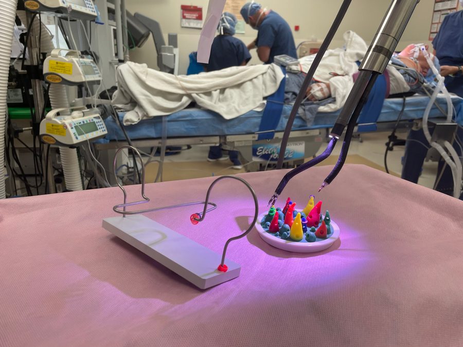 Robotic surgical instruments working on dexterity training exercises in the operating room